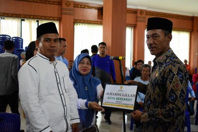 Pejabat dan ASN OKI Salurkan Zakat Lewat…